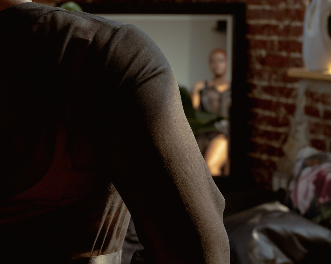 Person sitting on a couch with a blurred background