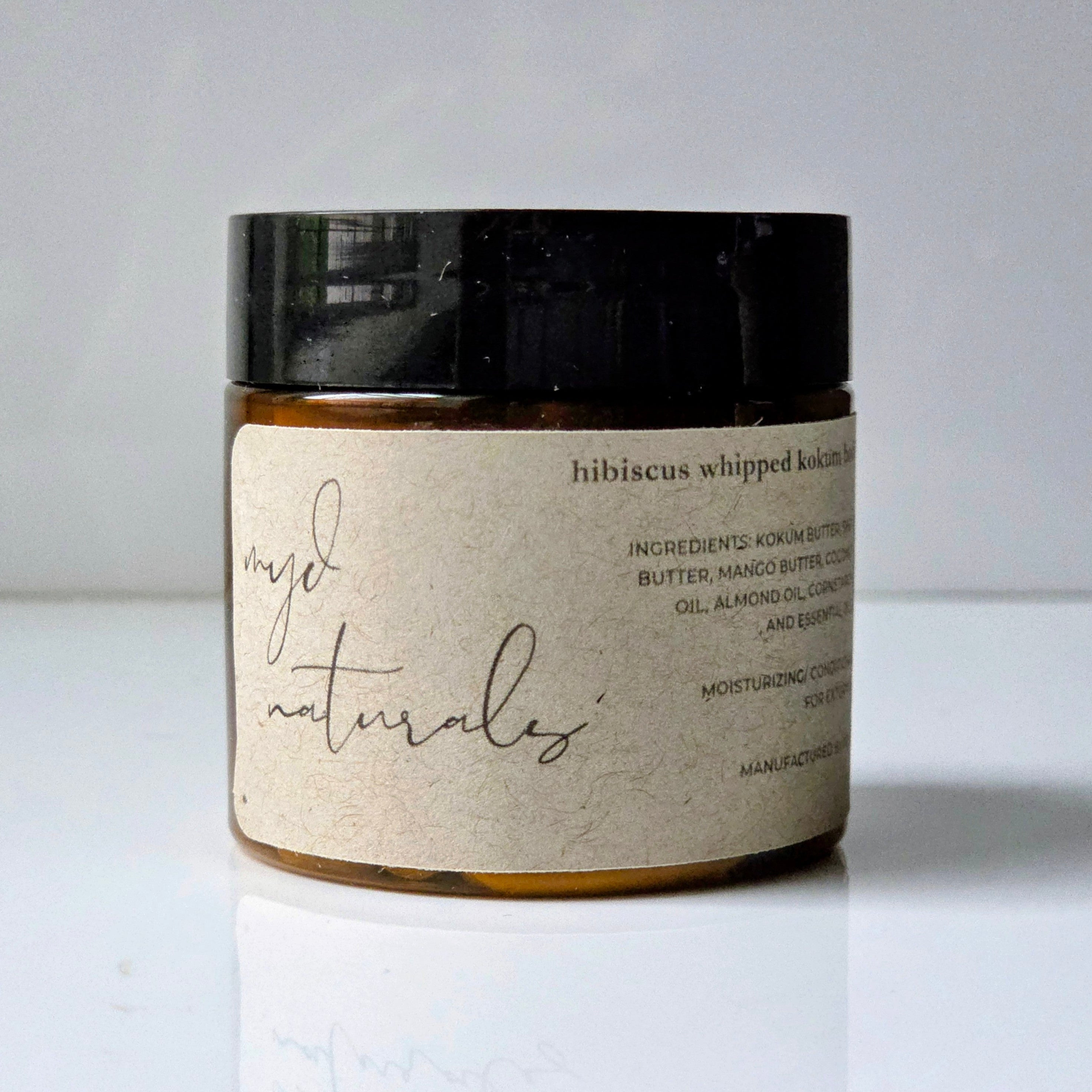 Jar of 'hijabiscus whipped body butter' by 'majo naturals' on a white background