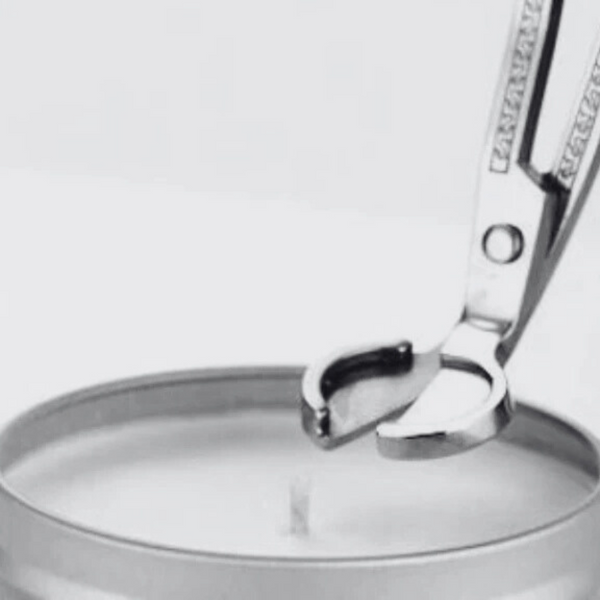 Close-up of a silver watch with a clear glass cover on a white background
