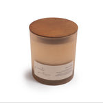 Candle with wooden lid on a white background