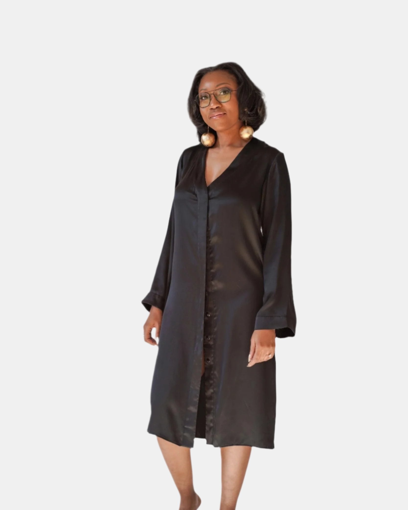 made in the softest washed silk charmeuse, this hidden button front night dress can be worn as a robe or shirtdress , in and outside of the boudoir  belt loop is subtly and discretely hidden behind the back placket  complete with resting pockets  wear with a je mérite coordinating bottom or chemise  soft collar v-neck neckline subtle slits at sides removable belt sensual fit midi length  washed 100% silk charmeuse  designed and made in new york city, new york - available in 0/2-20/22