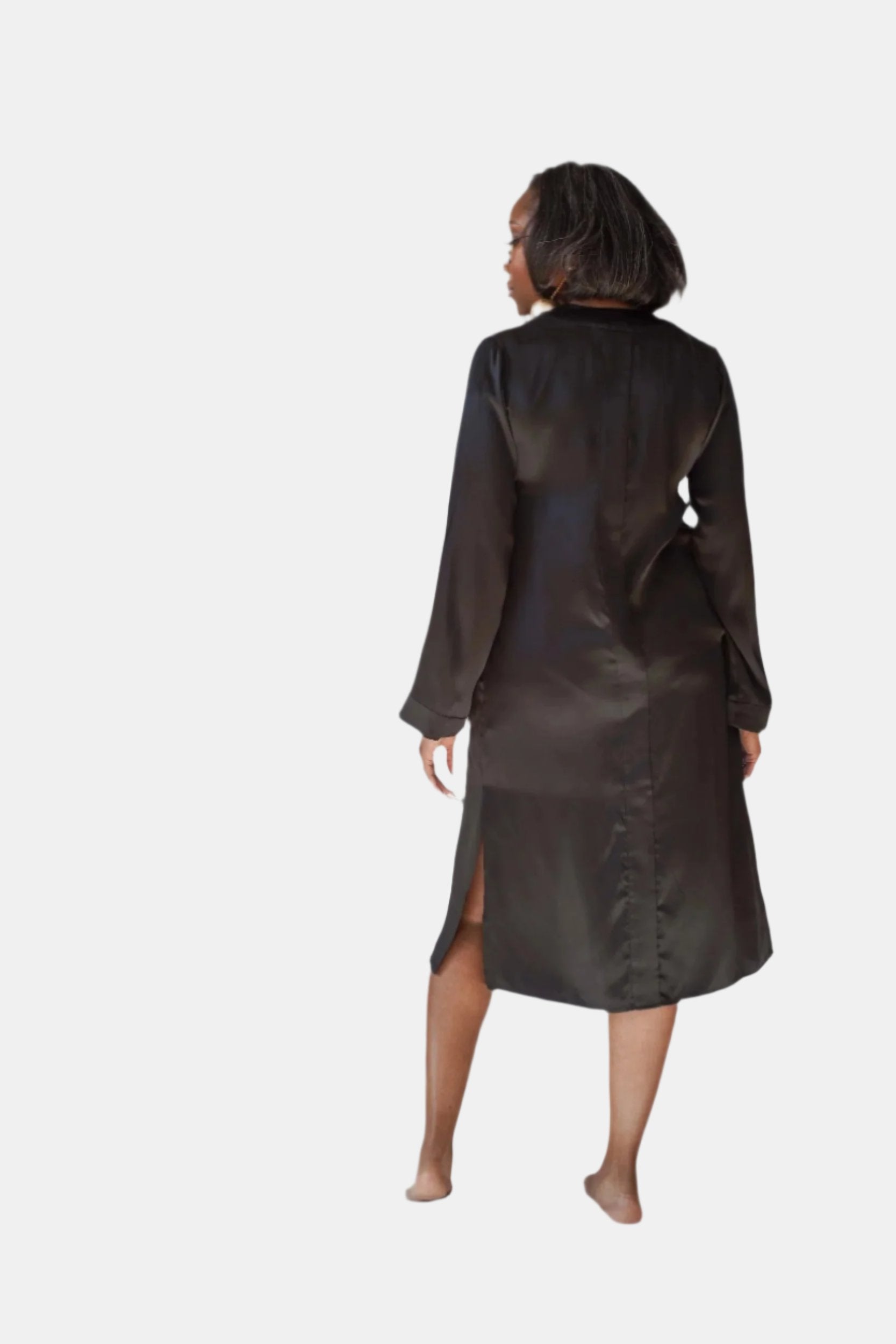 made in the softest washed silk charmeuse, this hidden button front night dress can be worn as a robe or shirtdress , in and outside of the boudoir  belt loop is subtly and discretely hidden behind the back placket  complete with resting pockets  wear with a je mérite coordinating bottom or chemise  soft collar v-neck neckline subtle slits at sides removable belt sensual fit midi length  washed 100% silk charmeuse  designed and made in new york city, new york - available in 0/2-20/22