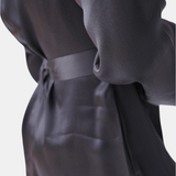 made in the softest washed silk charmeuse, this hidden button front shirt dress can be worn as a robe, pajama top or shirtdress, in and outside of the boudoir  belt loop is subtly and discretely hidden behind the back placket  complete with resting pockets  wear with a je mérite coordinating bottom or chemise  soft collar v-neck neckline subtle slits at sides removable belt sensual fit mini length  washed 100% silk charmeuse  designed and made in new york city, new york - available in 0/2-20/22