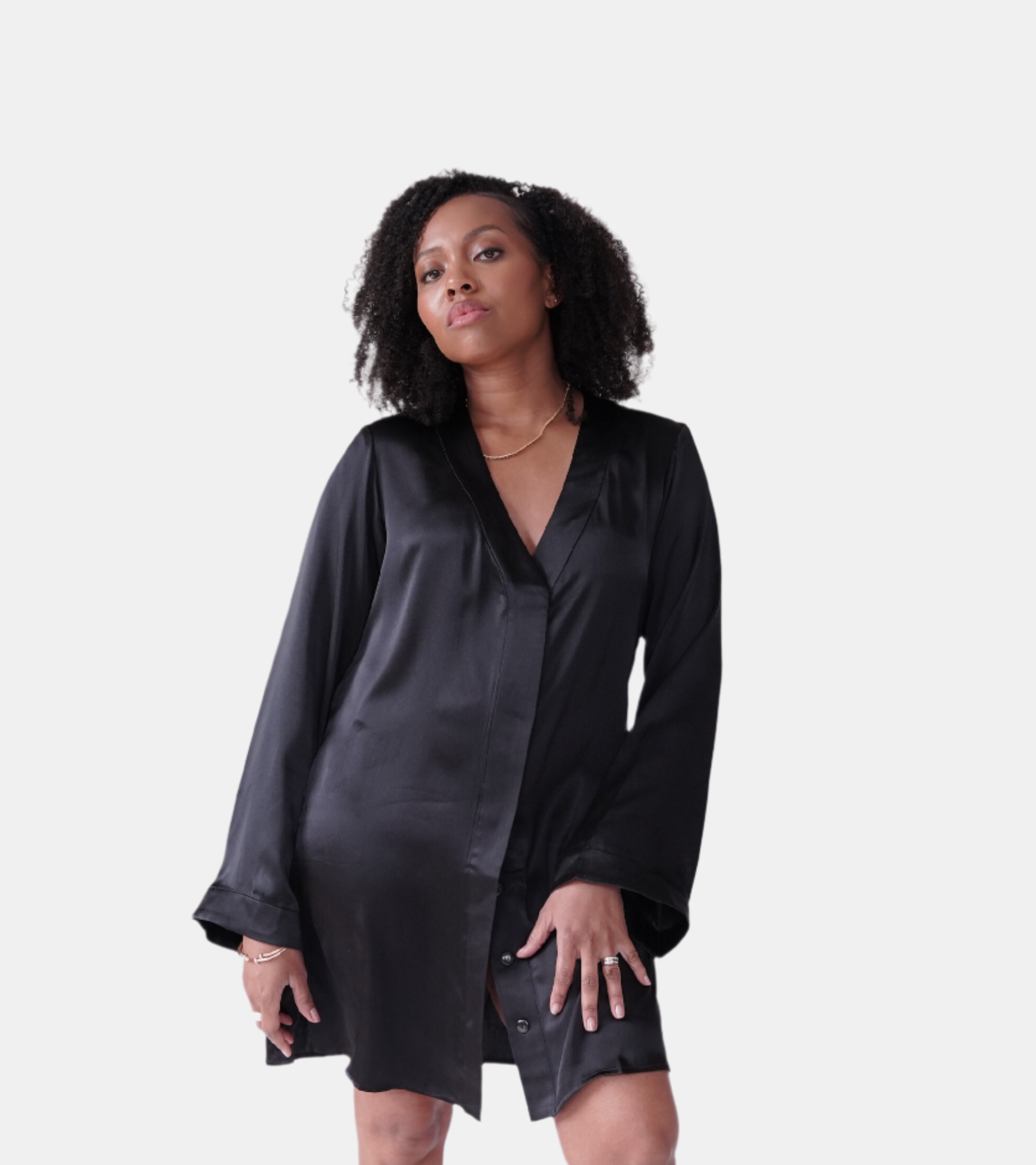 made in the softest washed silk charmeuse, this hidden button front shirt dress can be worn as a robe, pajama top or shirtdress, in and outside of the boudoir  belt loop is subtly and discretely hidden behind the back placket  complete with resting pockets  wear with a je mérite coordinating bottom or chemise  soft collar v-neck neckline subtle slits at sides removable belt sensual fit mini length  washed 100% silk charmeuse  designed and made in new york city, new york - available in 0/2-20/22