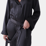 made in the softest washed silk charmeuse, this hidden button front shirt dress can be worn as a robe, pajama top or shirtdress, in and outside of the boudoir  belt loop is subtly and discretely hidden behind the back placket  complete with resting pockets  wear with a je mérite coordinating bottom or chemise  soft collar v-neck neckline subtle slits at sides removable belt sensual fit mini length  washed 100% silk charmeuse  designed and made in new york city, new york - available in 0/2-20/22