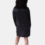 made in the softest washed silk charmeuse, this hidden button front shirt dress can be worn as a robe, pajama top or shirtdress, in and outside of the boudoir  belt loop is subtly and discretely hidden behind the back placket  complete with resting pockets  wear with a je mérite coordinating bottom or chemise  soft collar v-neck neckline subtle slits at sides removable belt sensual fit mini length  washed 100% silk charmeuse  designed and made in new york city, new york - available in 0/2-20/22