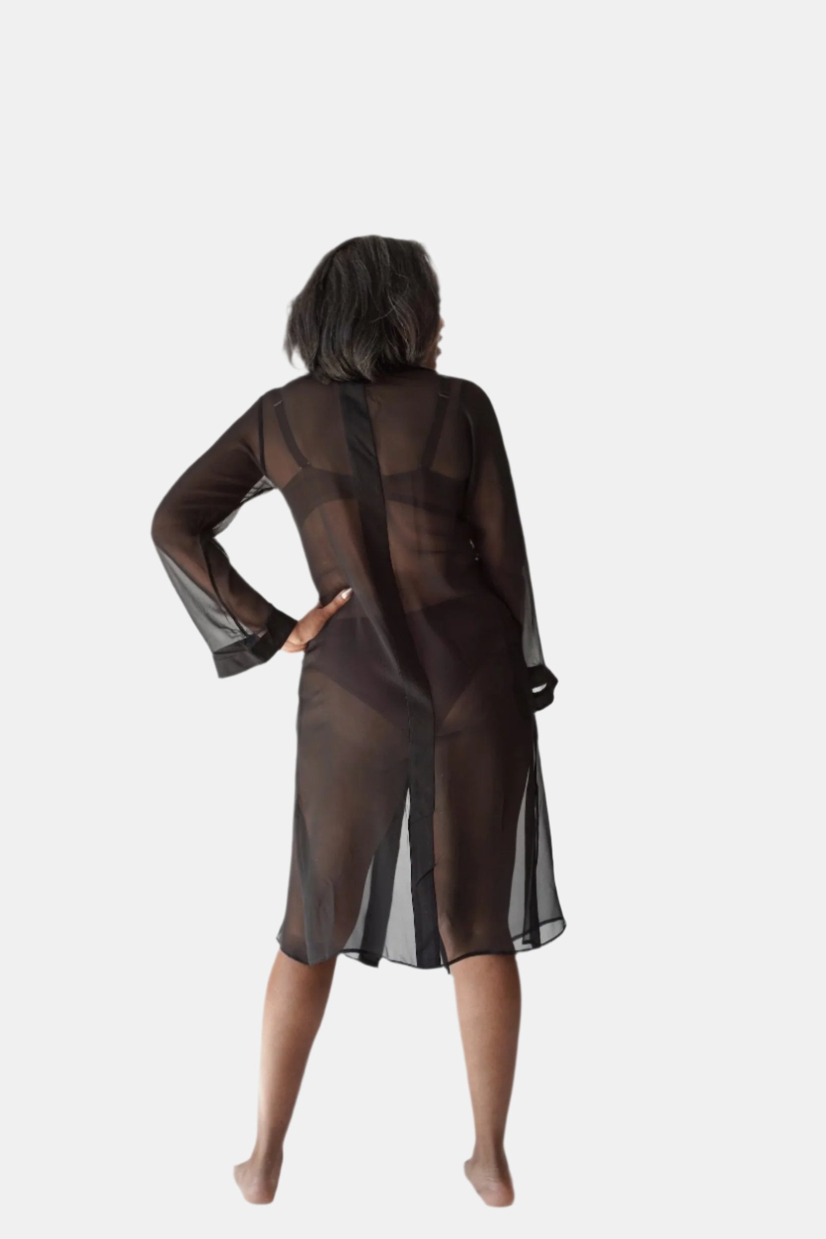 made from silk chiffon, this hidden button front nightdress can be worn open or fully buttoned, in and outside of the boudoir as a robe or a shirtdress (shirt dress)  belt loop is subtly and discretely hidden behind the back placket  complete with resting pockets  wear with a je mérite coordinating bottom or chemise  soft collar v-neck neckline subtle slits at sides sensual fit midi length 100% silk chiffon charmeuse designed and made in new york city, new york - available in 0/2-20/22