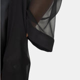 made from silk chiffon, this hidden button front nightdress can be worn open or fully buttoned, in and outside of the boudoir as a robe or a shirtdress (shirt dress)  belt loop is subtly and discretely hidden behind the back placket  complete with resting pockets  wear with a je mérite coordinating bottom or chemise  soft collar v-neck neckline subtle slits at sides sensual fit midi length 100% silk chiffon charmeuse designed and made in new york city, new york - available in 0/2-20/22