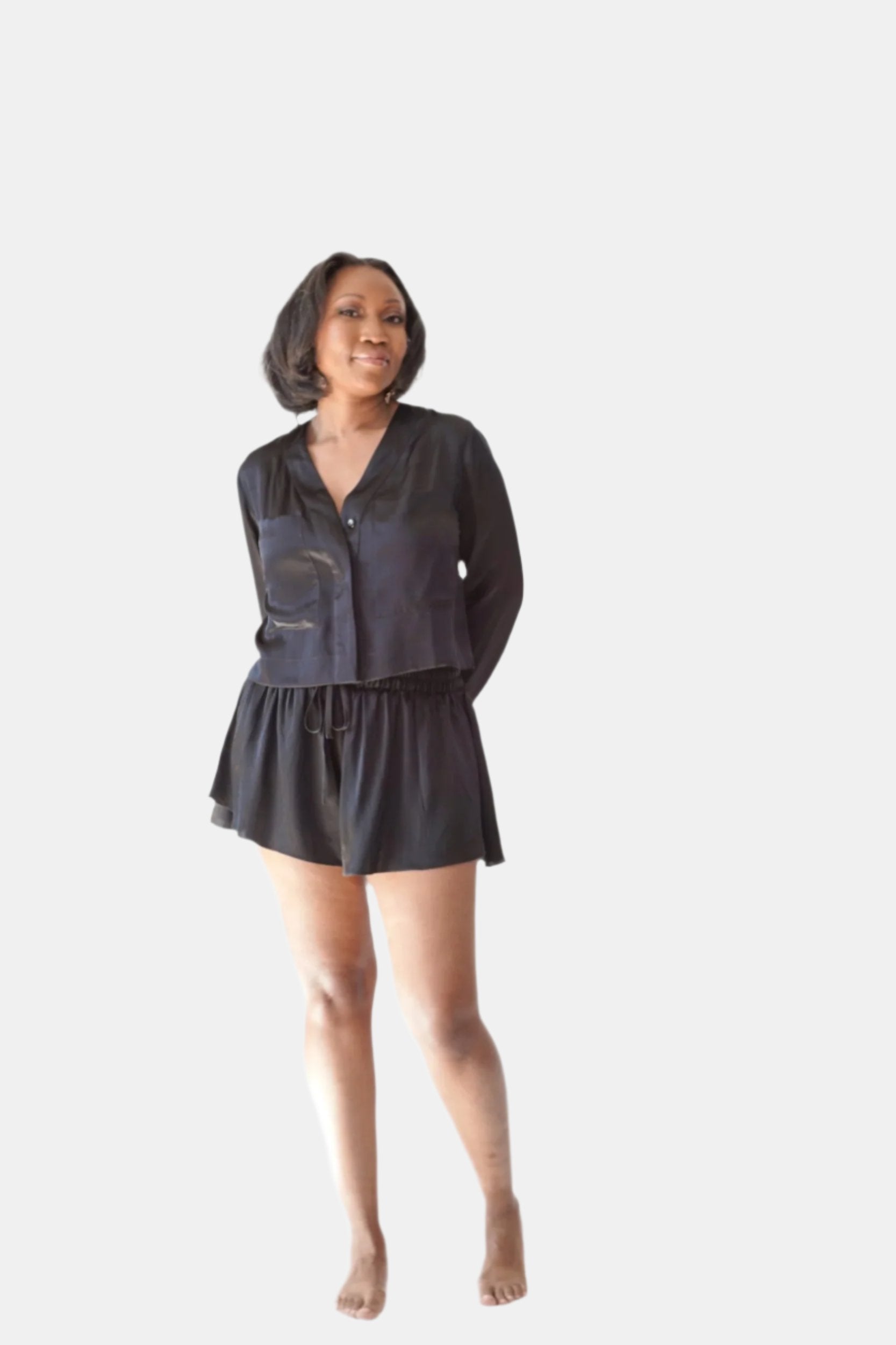 made in the softest washed silk charmeuse, this hidden button front cropped sleep shirt can be worn as a pajama top or shirt, in and outside of the boudoir wear with a je mérite coordinating bottom  soft collar v-neck neckline subtle slits at sides cropped just below the belly button  washed 100% silk charmeuse  designed and made in new york city, new york - available in 0/2-20/22