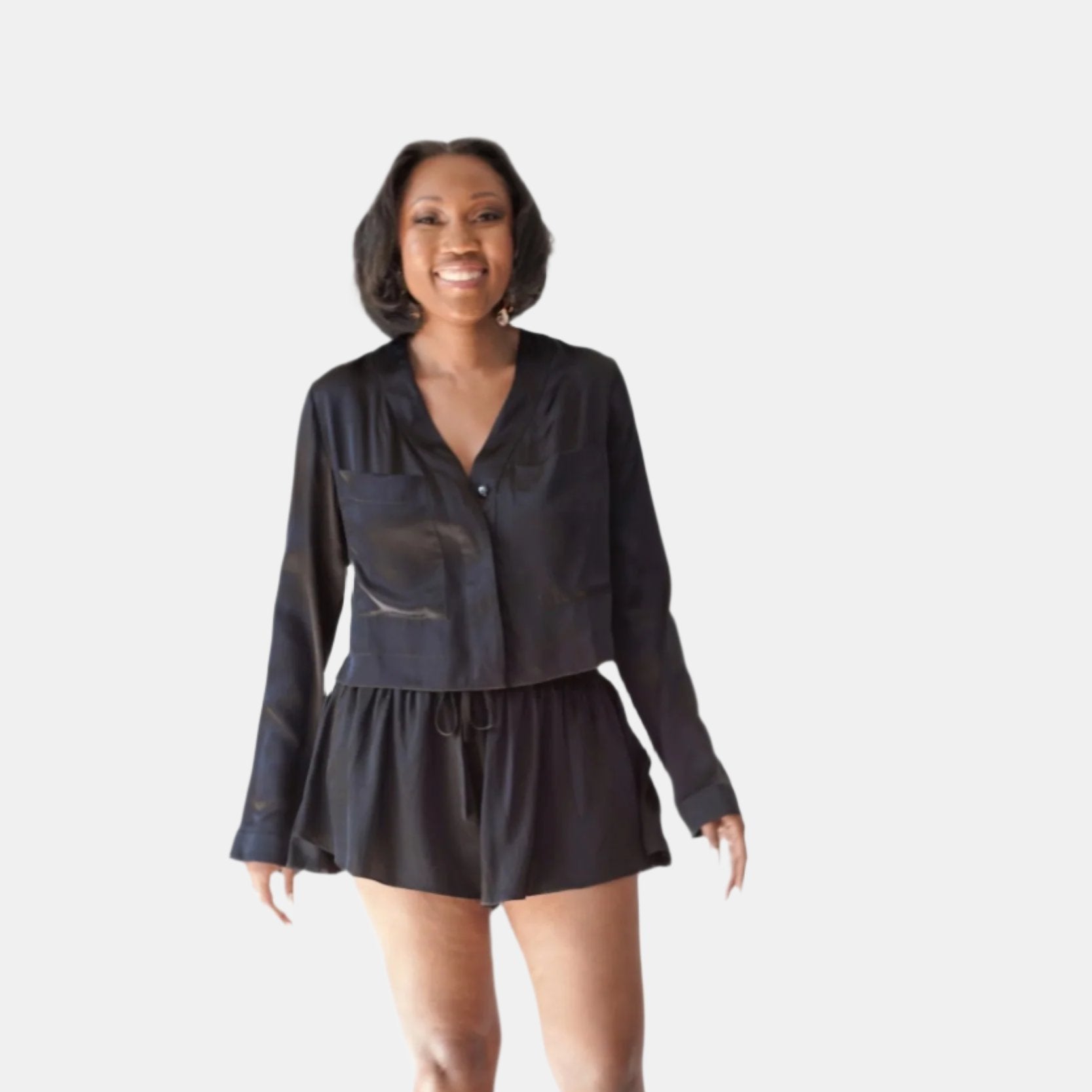 made in the softest washed silk charmeuse, this hidden button front cropped sleep shirt can be worn as a pajama top or shirt, in and outside of the boudoir wear with a je mérite coordinating bottom  soft collar v-neck neckline subtle slits at sides cropped just below the belly button  washed 100% silk charmeuse  designed and made in new york city, new york - available in 0/2-20/22