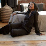 made in the softest washed silk charmeuse, this tuxedo pajama pant has an elastic waistband and drawstring closure  wear with a je mérite coordinating top or your favorite lingerie  wide elastic waist with drawstring closure pockets sits at natural waist tuxedo panels wide leg  washed 100% silk charmeuse designed and made in new york city, new york - available in 0/2-20/22