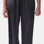 made in the softest washed silk charmeuse, this tuxedo pajama pant has an elastic waistband and drawstring closure  wear with a je mérite coordinating top or your favorite lingerie  wide elastic waist with drawstring closure pockets sits at natural waist tuxedo panels wide leg  washed 100% silk charmeuse designed and made in new york city, new york - available in 0/2-20/22