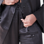 made in the softest washed silk charmeuse, this tuxedo pajama pant has an elastic waistband and drawstring closure  wear with a je mérite coordinating top or your favorite lingerie  wide elastic waist with drawstring closure pockets sits at natural waist tuxedo panels wide leg  washed 100% silk charmeuse designed and made in new york city, new york - available in 0/2-20/22