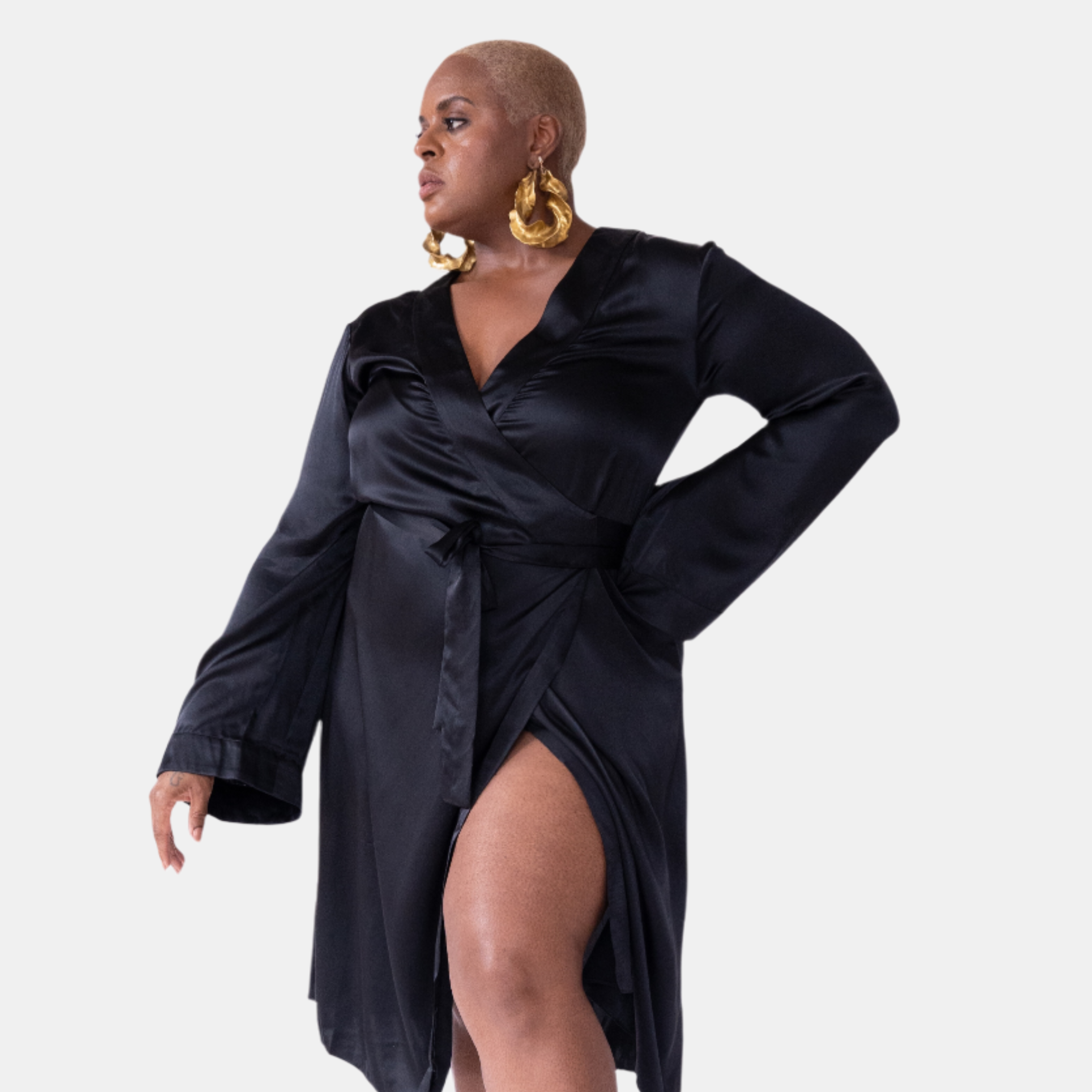 made in the softest washed silk charmeuse, this double-breasted wrap robe has long bell sleeves  wear barefoot, with a soft fuzzy slipper for a night in, or a strappy heel for a night on the town  soft collar wrap belt (not removable) relaxed fit midi length  washed 100% silk charmeuse  designed in new york city, new york made in new york city, new york   size details - available in 0/2-20/22