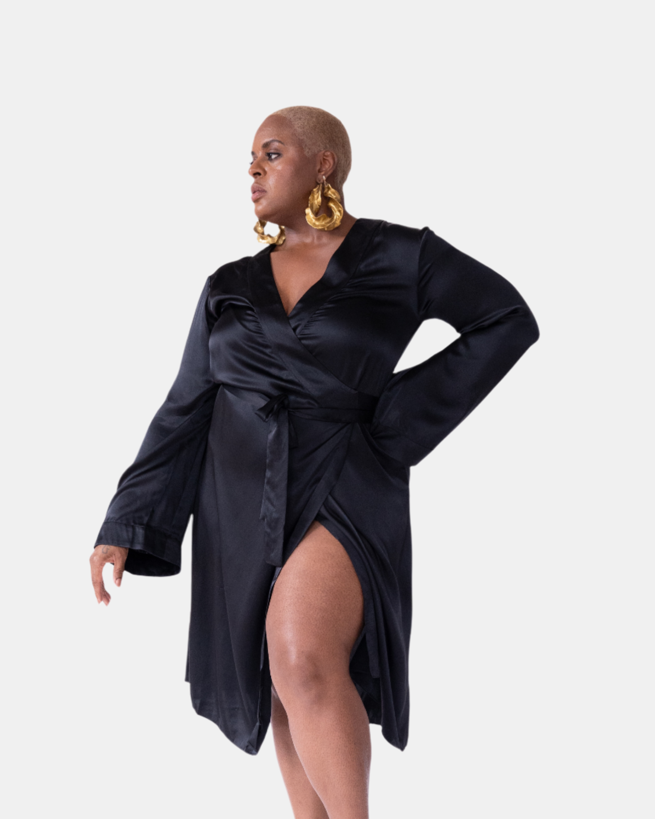 made in the softest washed silk charmeuse, this double-breasted wrap robe has long bell sleeves  wear barefoot, with a soft fuzzy slipper for a night in, or a strappy heel for a night on the town  soft collar wrap belt (not removable) relaxed fit midi length  washed 100% silk charmeuse  designed in new york city, new york made in new york city, new york   size details - available in 0/2-20/22