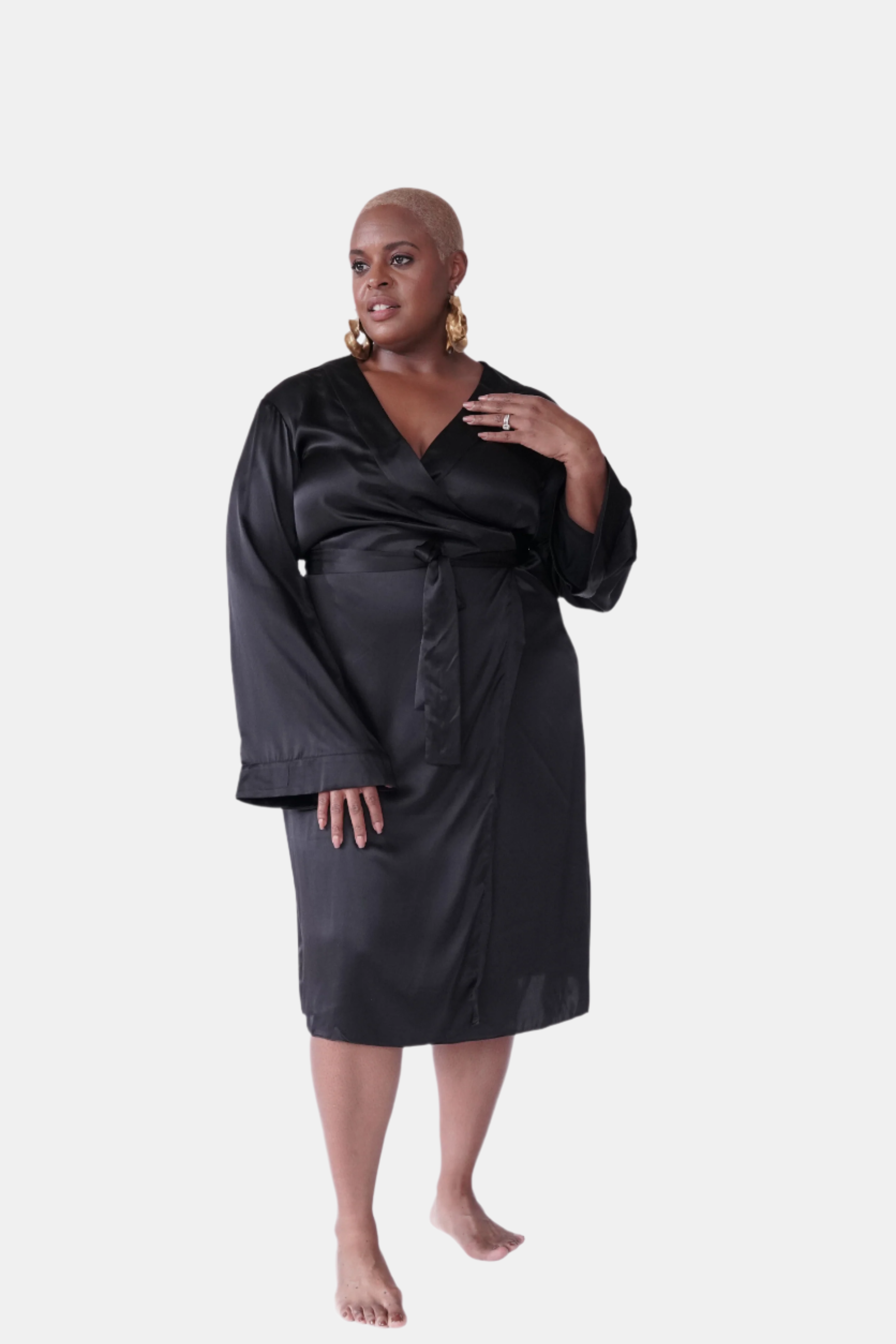 made in the softest washed silk charmeuse, this double-breasted wrap robe has long bell sleeves  wear barefoot, with a soft fuzzy slipper for a night in, or a strappy heel for a night on the town  soft collar wrap belt (not removable) relaxed fit midi length  washed 100% silk charmeuse  designed in new york city, new york made in new york city, new york   size details - available in 0/2-20/22
