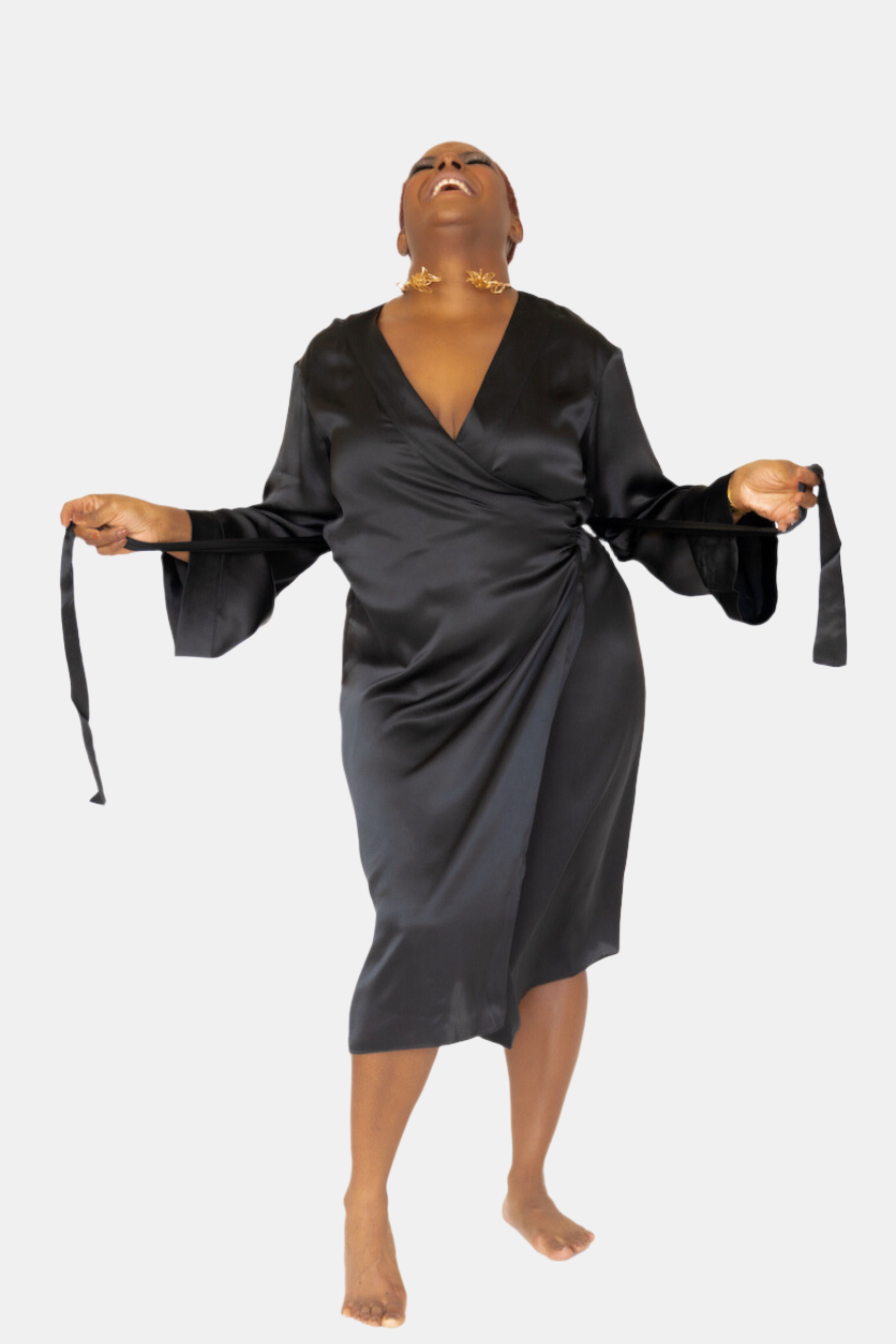 made in the softest washed silk charmeuse, this double-breasted wrap robe has long bell sleeves  wear barefoot, with a soft fuzzy slipper for a night in, or a strappy heel for a night on the town  soft collar wrap belt (not removable) relaxed fit midi length  washed 100% silk charmeuse  designed in new york city, new york made in new york city, new york   size details - available in 0/2-20/22