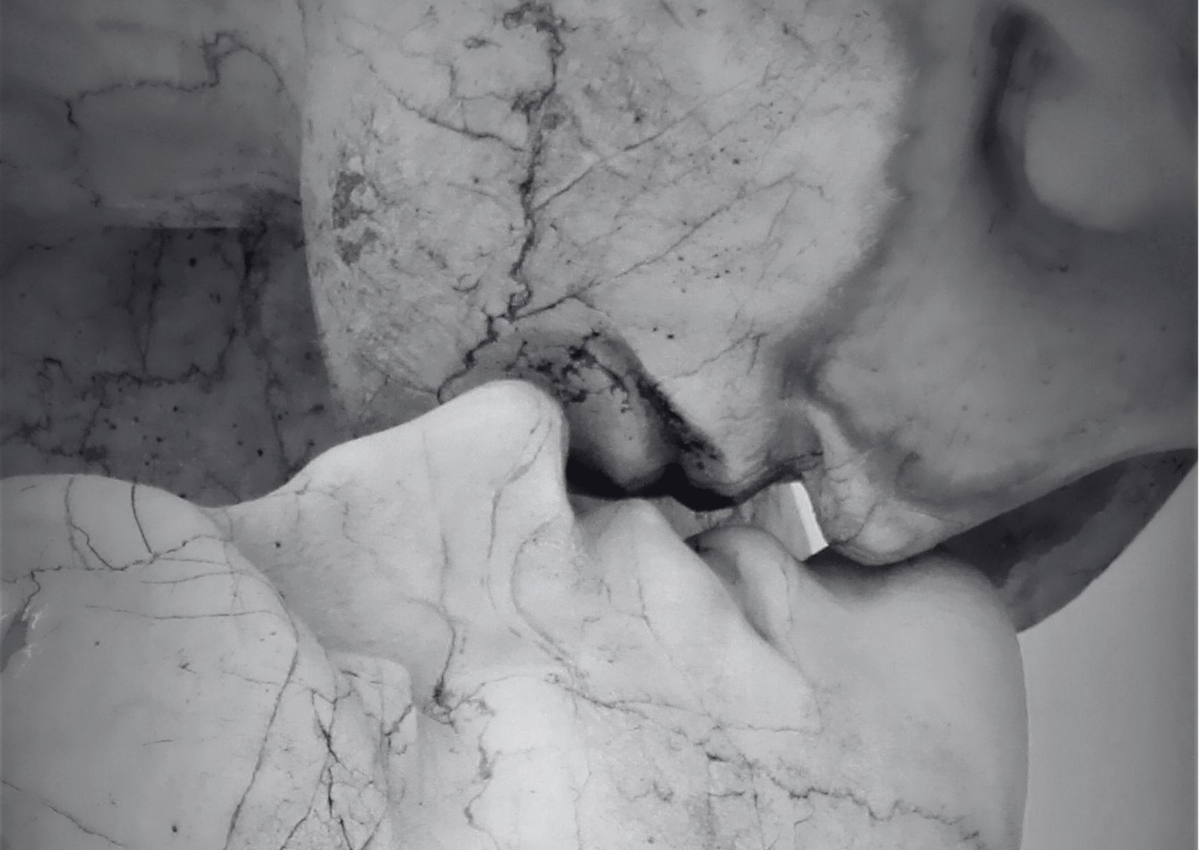 Close-up of a broken ceramic vase with a hand holding it.